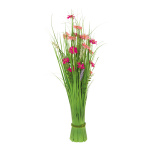 Bundle of grass with spring flowers out of...