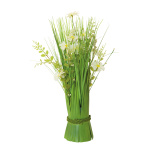 Bundle of grass with spring flowers out of...