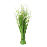Bundle of grass with spring flowers out of...